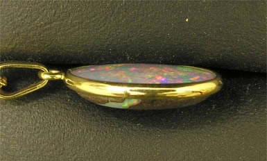 Opal pendant, side view