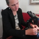 Ms Scuderini setting up an item for examination under a gemmological microscope.